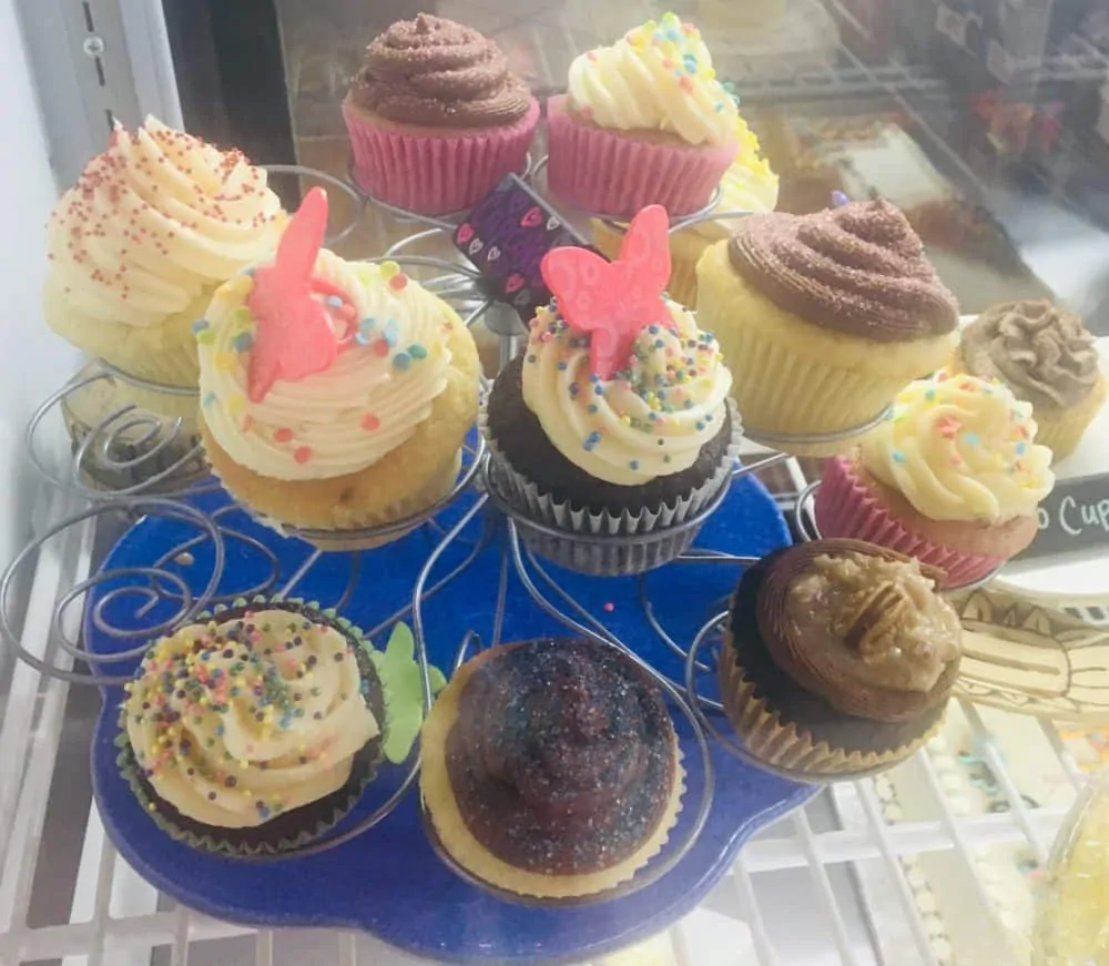 the enticing cupcakes on display at los ranchos bakery & cafe