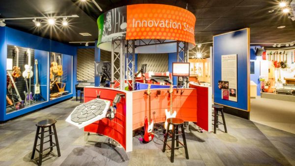 An interactive station at san diego's museum of making music offers tools and instruments for making music.