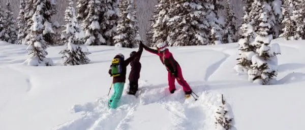 Here's How To Plan A Memorable Vacation With Your Teen a ski instructor in whistler high fives two teens