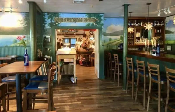 the bar and dining room of the comfortable blue mingo restaurant on otsego lake. 