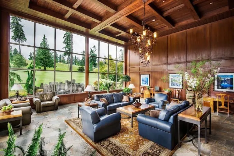 the large, comfortable lobby with a glass wall facing the golf course at olympic lodge in port angeles
