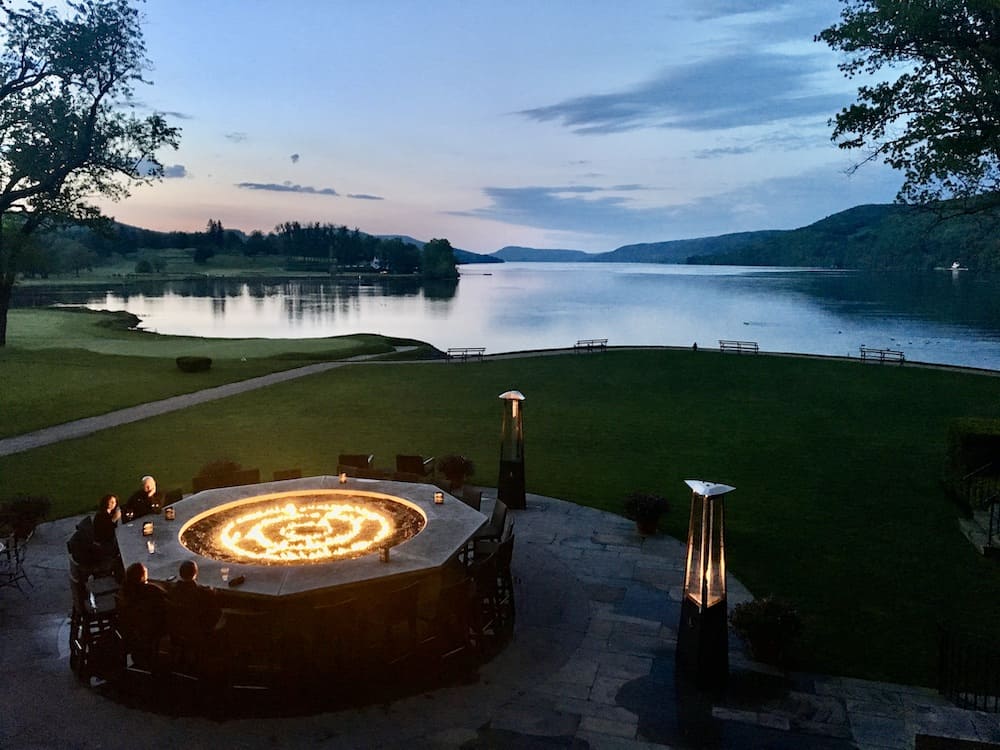 the firebar at the otesaga resort is the ideal place for a sunset view of lake otsego on a chilly evening.
