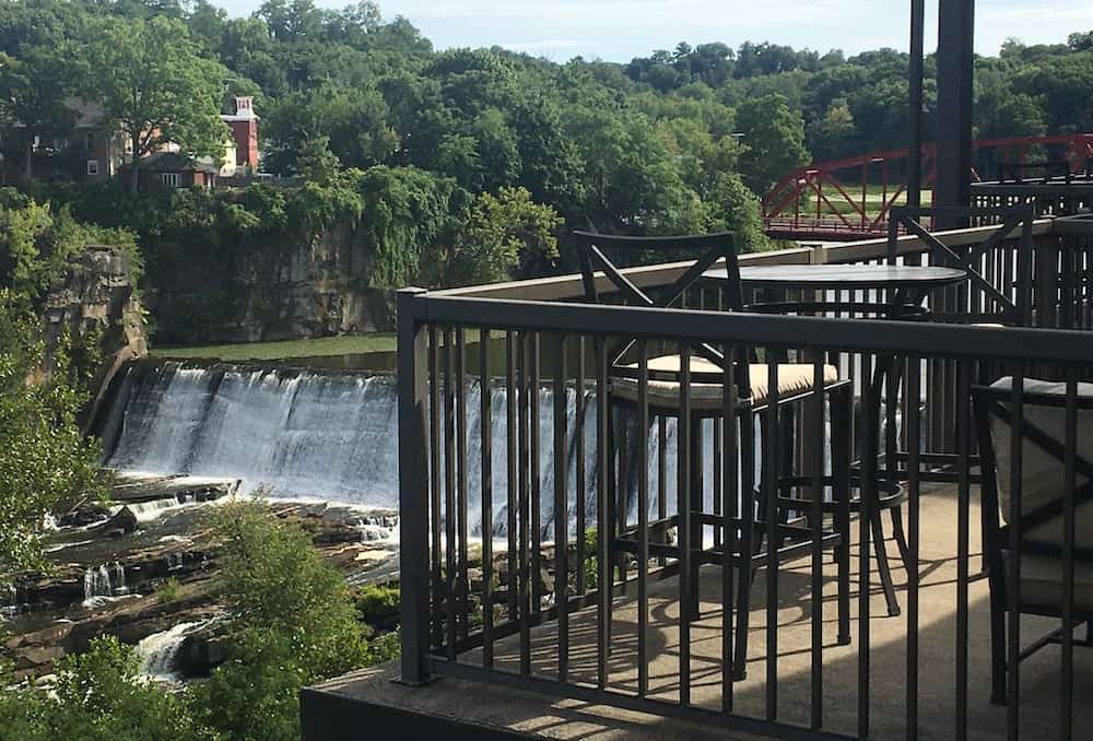 the esopus creek falls and saugerties bridge as seen from a room's balcony at the diamond mills hotel.