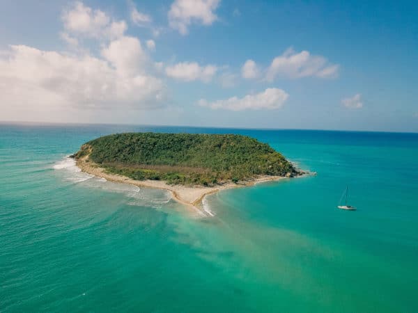 The island of vieques, puerto rico, from the air, surrounded by the clear blue and green caribbean sea for snorkeling.