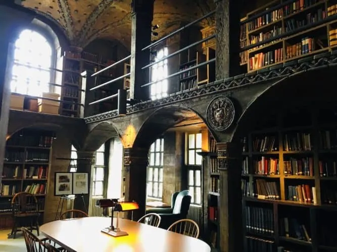 the ornate library room with art depicting local history at the mercer museum near new hope, pa