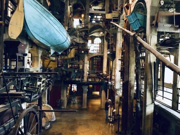 Ther cluttered, cement atrium of the mercer museum in doylestown, pa