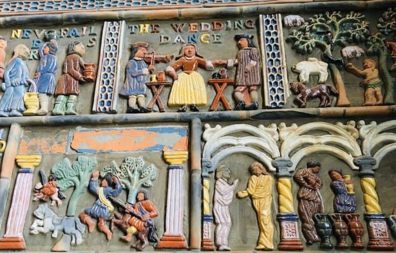 Brightly colored moravian tiles with panels depicting stories at the mercer museum in bucks county, pa