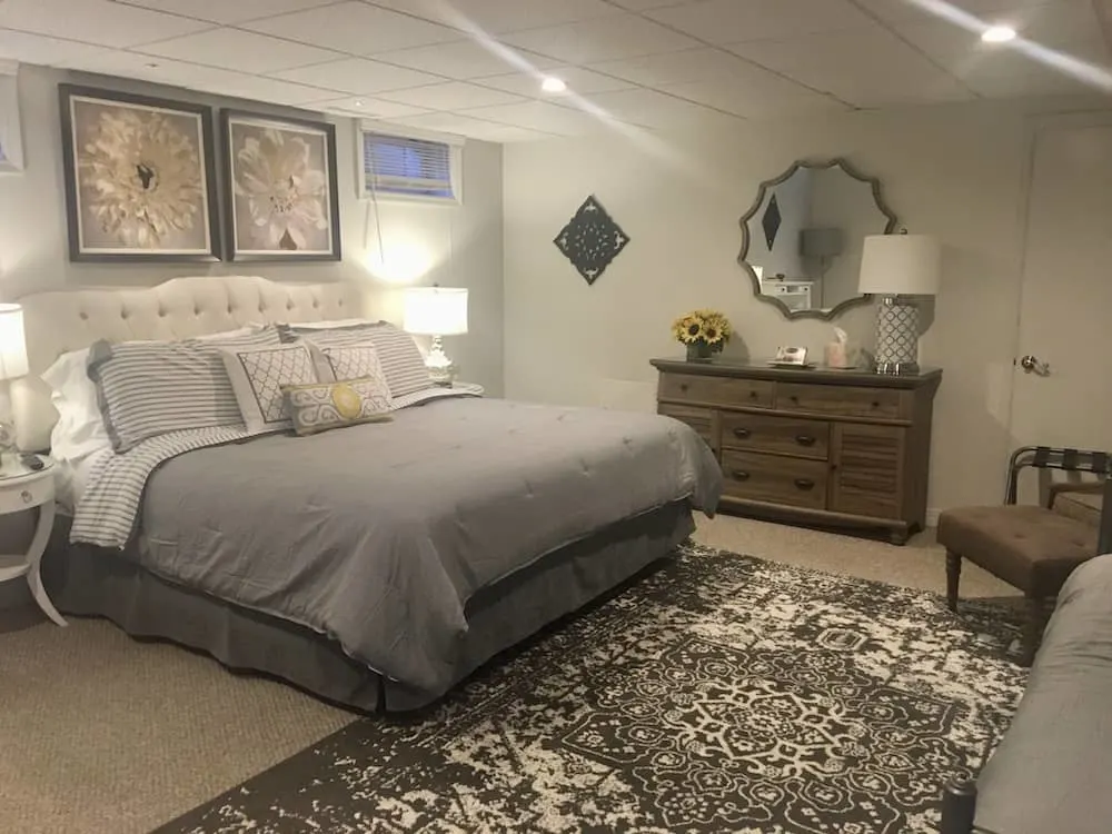 the sunflower room at the mountain meadow is decorated in tastefull grays and sunflower details.