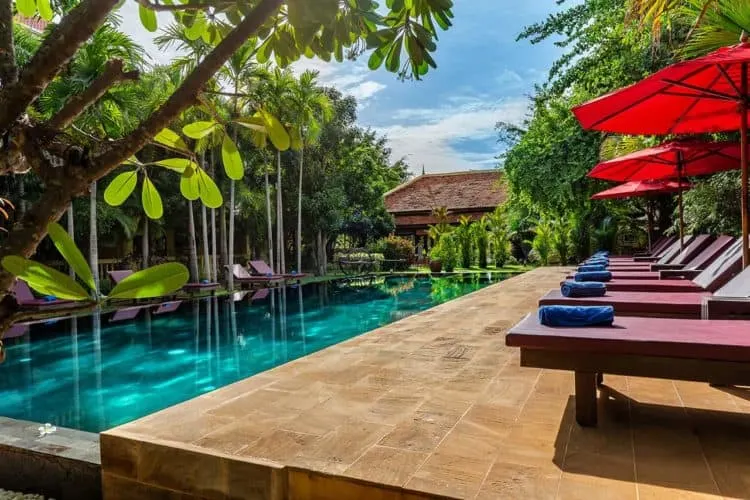 the long pool and secluded deck at the pavilion d'orient in siem reap