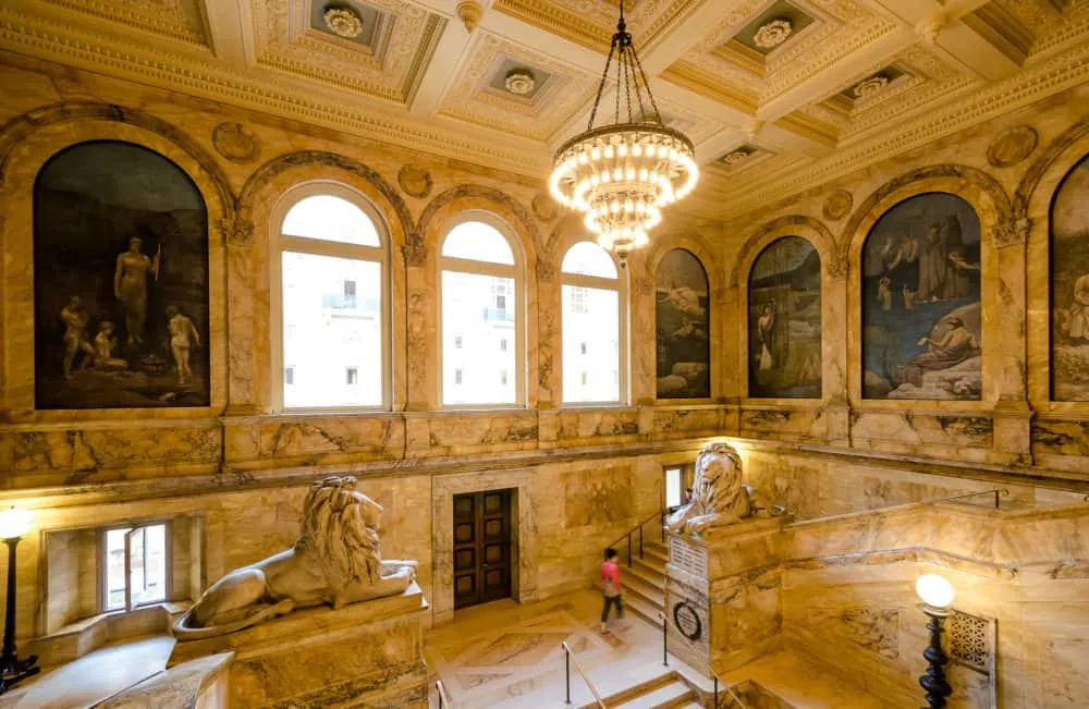 the marble staircases, murals and grand chandeliers at the boston central library