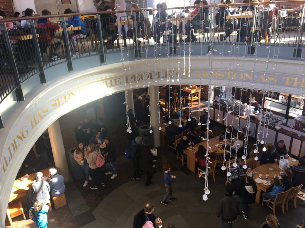 The busy two-story food hall at quincy market
