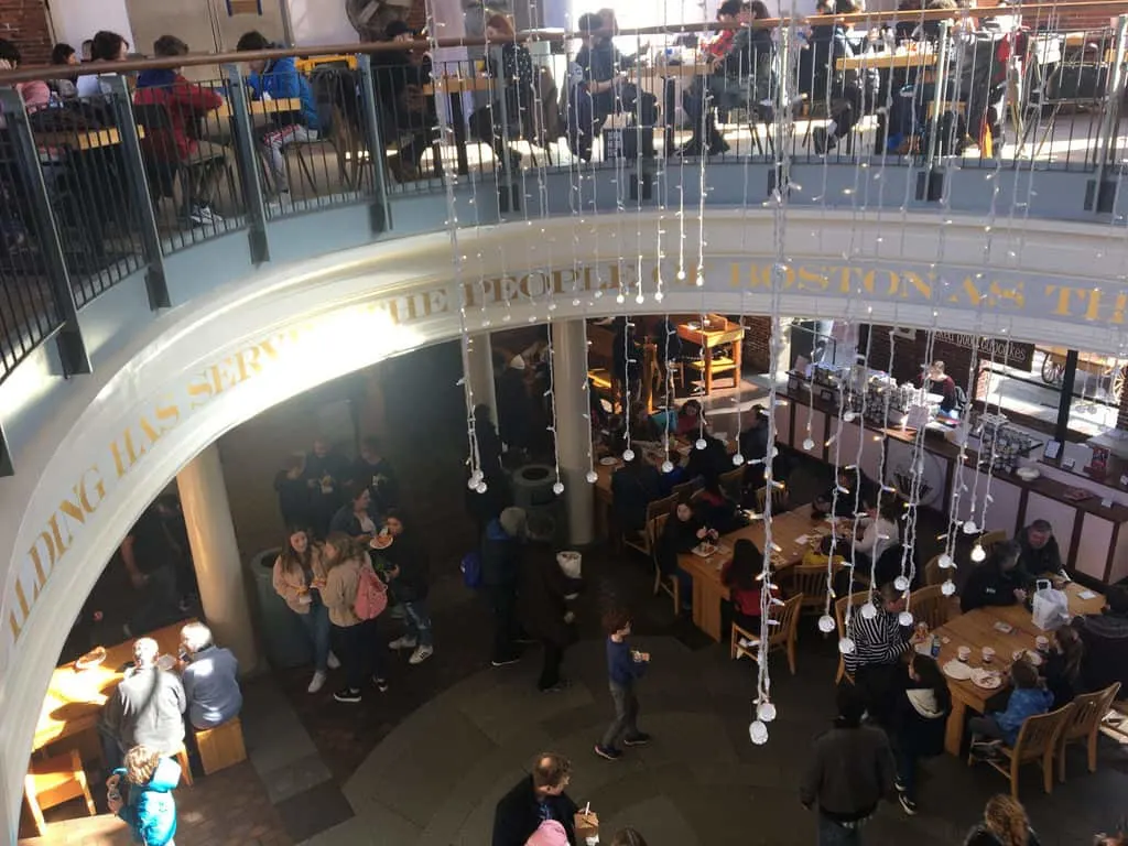 the busy two-story food hall at quincy market