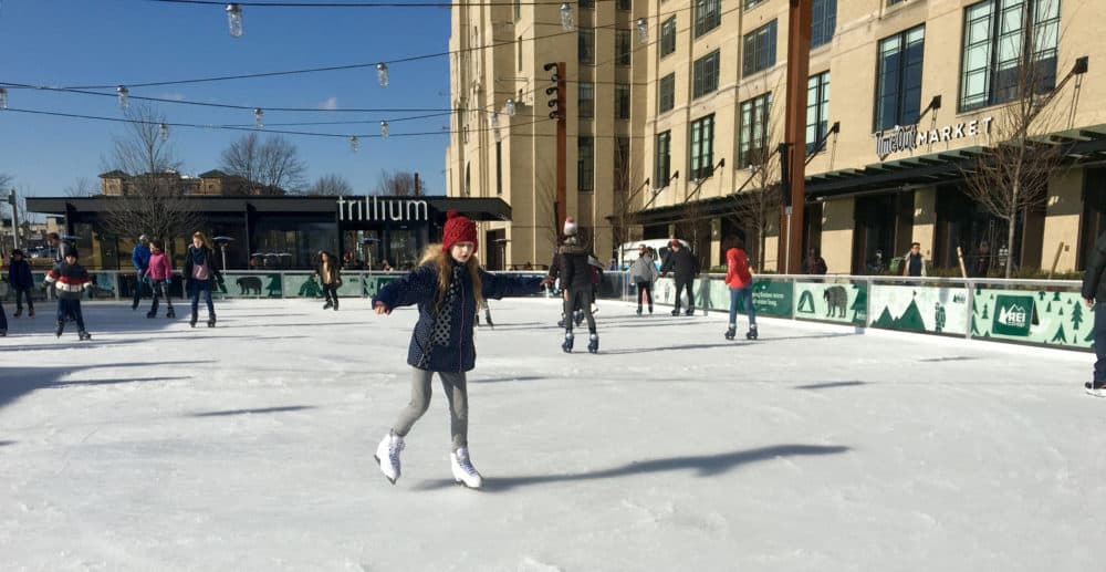 A seasonal ice rink in landrmark park near fenway park.