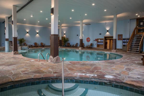 The oval indoor pool and hot tub at the golden arrow hotel in lake placid