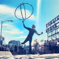 48 Hours in Seattle : 15+ Things You'll Love Doing With Kids: A busker juggles outside of Pike Place Market in Seattle