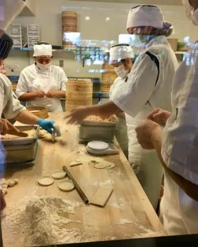 Seattle Weekend Getaway: 15 Of The Best Things To Do With Kids watching the cooks make dozens of dumplings at din tai fung in seattle.