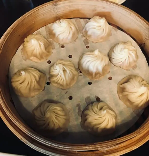 Seattle Weekend Getaway: 15 Of The Best Things To Do With Kids a basket of dumplings from din tai fung in university heights.