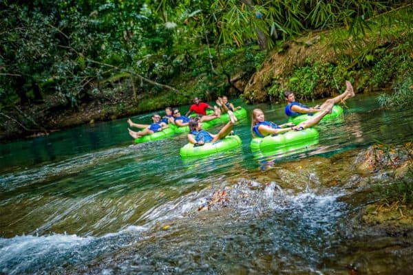 Tubing down a river in negril jamaica, the type of activity you might try on a honeymoon with kids.