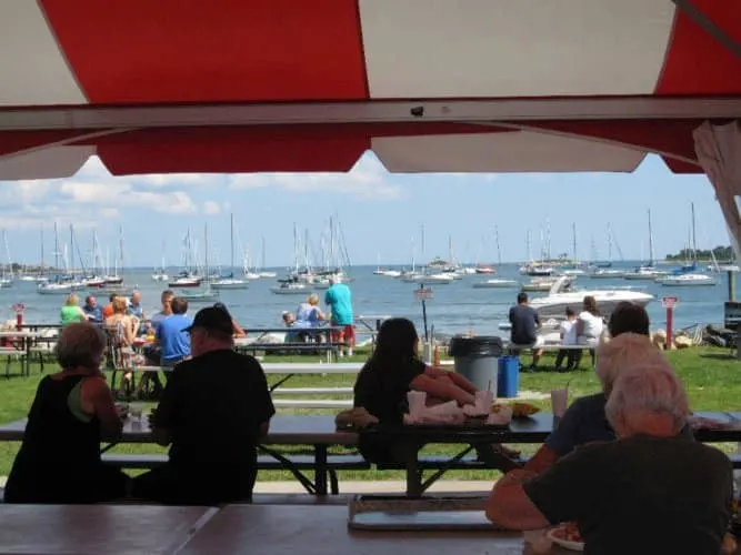 abbott's lobster shack has outdoor picnic tables with views of the sailboats in the long island sound.