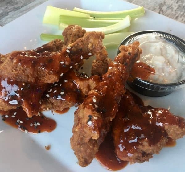 asian-style glazed long island duck wings at jerry & the mermaid