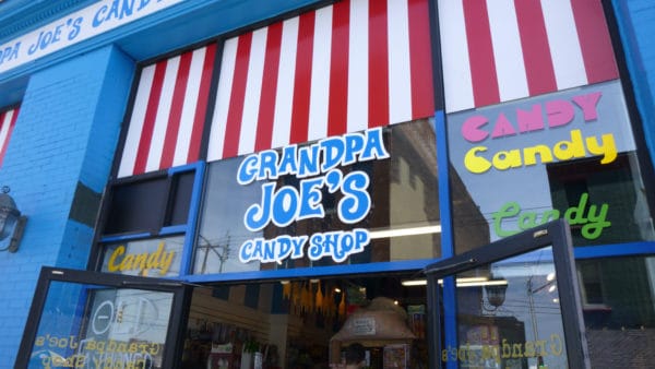 the hard to miss facade of grandpa joe;s candy shop on the strip