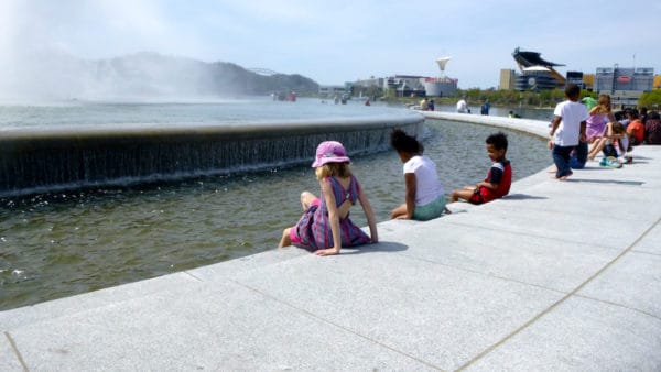 The fountain at point state park attracts kids for splashing while parents take in views that include the city's stadiums.