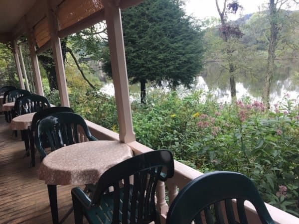 Al fresco dining on the porch a the river's edge cafe in the lurel highlands.