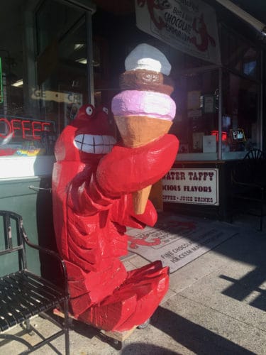 A lobster enjoys an ice cream cone in bar harbor