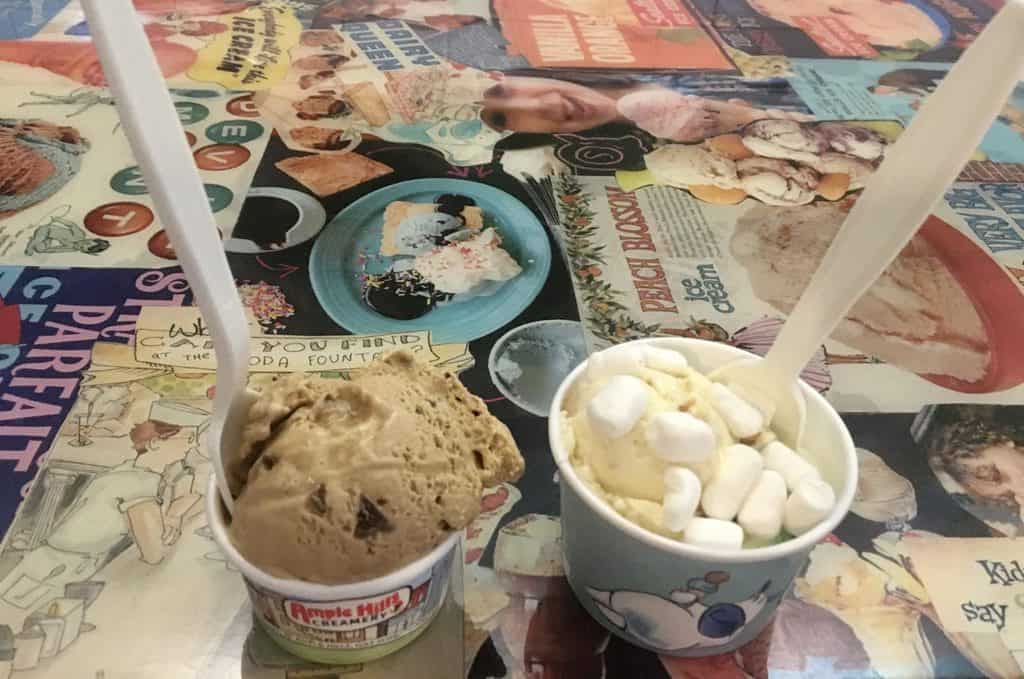 coffee-toffee ice cream and ooey gooey buttercake ice cream from ample hills creamery sitting on a table at its gowanus store. 