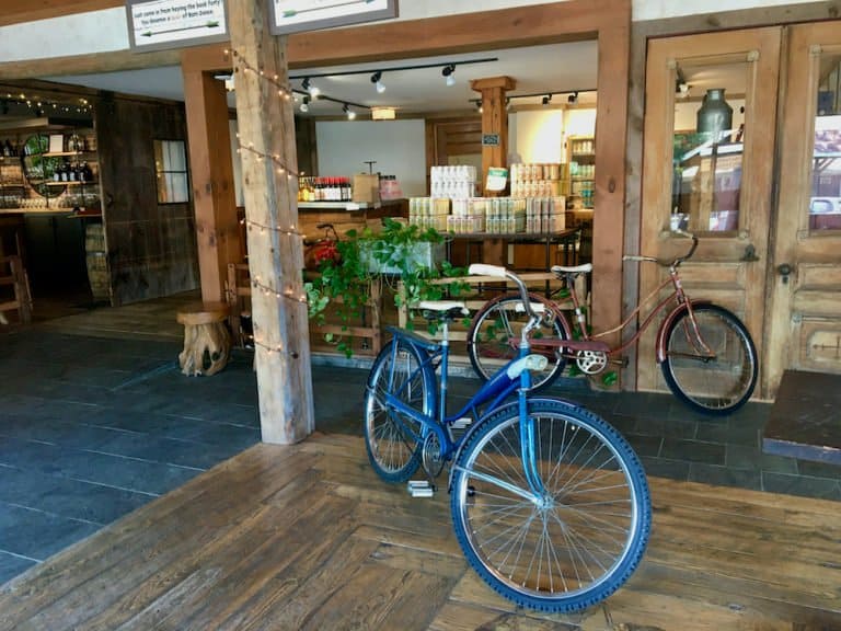 Cold hollow cider mill in vermont has a fun tasting room with bicycles parked inside and 4-packs to go.