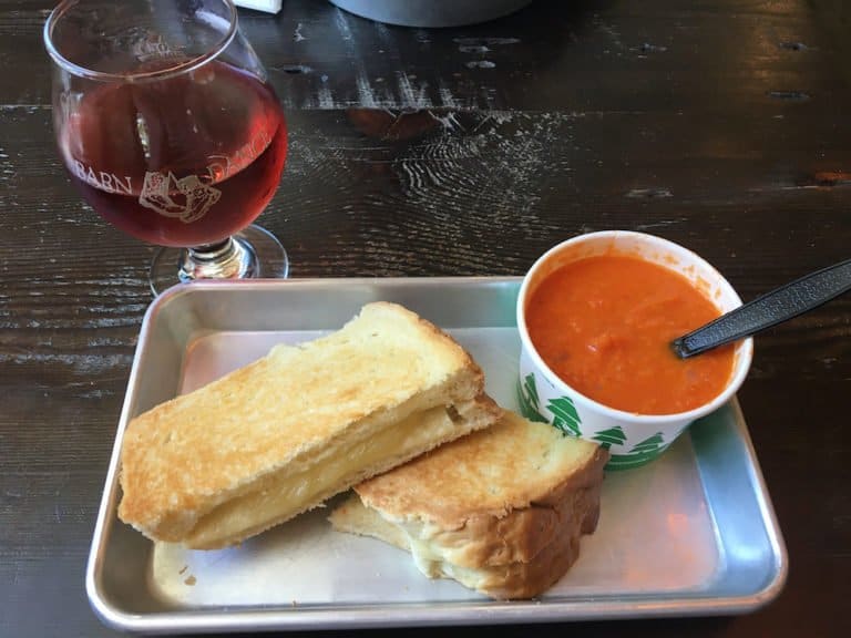 Grilled cheese on freshly baked white bread, homemade tomato soup and blueberry cider at cold hollow cider mill in stowe.