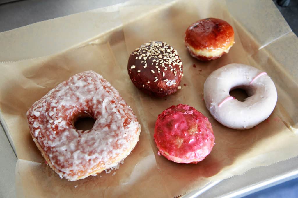Doughnut plant's square and mini  doughnuts, glazed or filled, are not your usual morning coffee companions