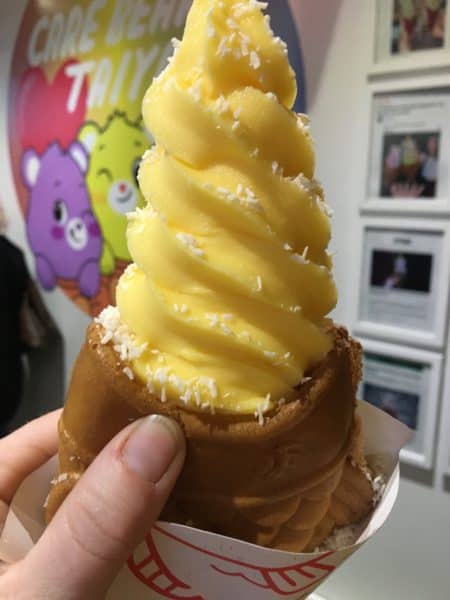 Mango ice cream in a custard fish cone with shredded coconut from taiyaki in nyc