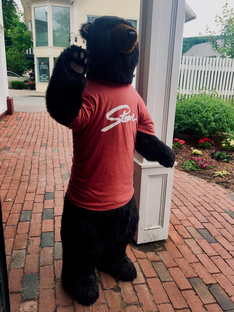 The stowe bear, in his official t-shirt, greets visitors to the stowe mercantile.