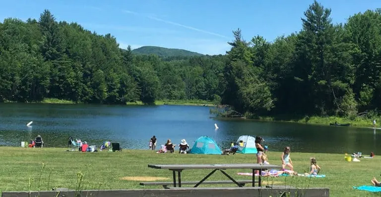 the lawn at waterbury state park offeres picnicking and the opportunity to swim in the pristine reservoir. 