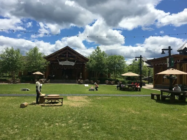 the green at sprink peak resort village has picnic tables, lawn games and whistlepig bbq for an easy kid-friendly lunch. 