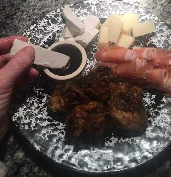 8 Molto Bene Ideas Staycation Italian Night Theme Party roasted artichokes, twirls of prosciutto, cubes of cheese and flavored balsamic vinegar make an easy antipasto plate for an italian night party.