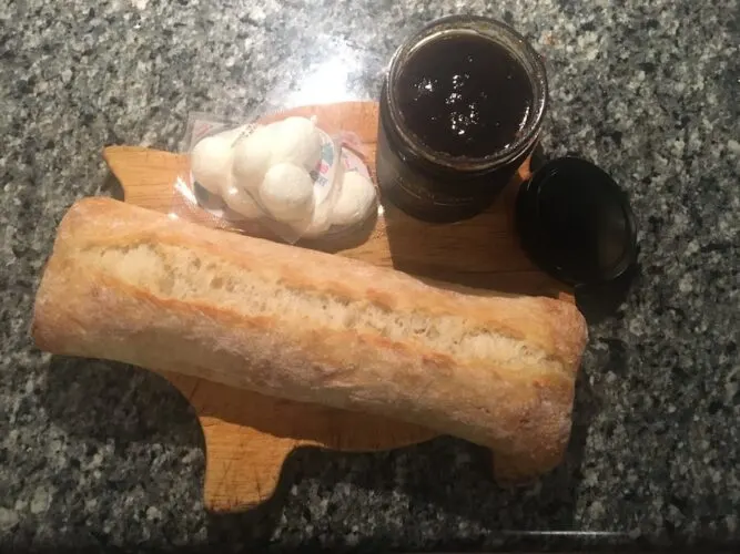 a loaf od ciabatta, mozzarella cheese and a jar of balsamic onion jam for making bruschetta