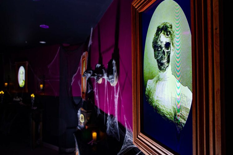 The portraits seem just a little odd at the dark and mysterious spookeasy pub at the gaylor rockies resort