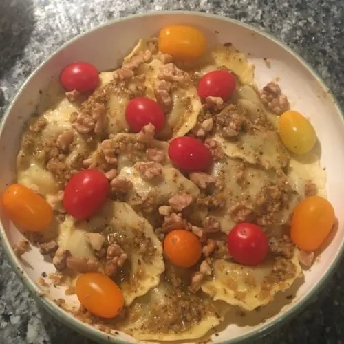 the final dish of our international night venetian cicchetti, mushroom ravioli with parmesan-asiago pest and red and yeellow cherry tomatoes.