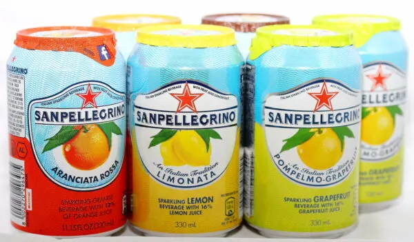 a selection of cans of san pellegrino italian soda, which kids will love as part of your italian theme night menu.