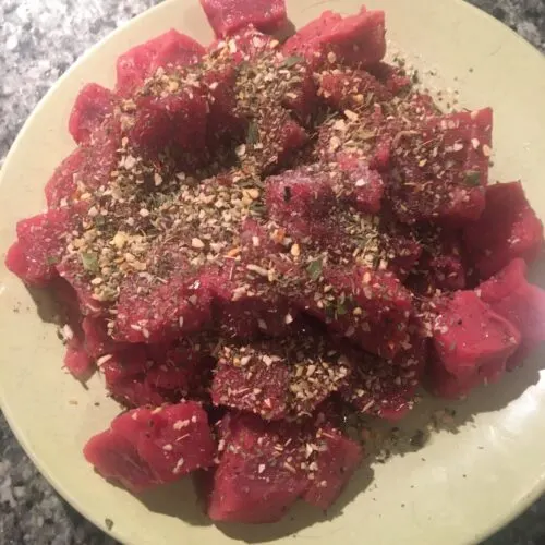8 Molto Bene Ideas Staycation Italian Night Theme Party beef cubes ready to be tossed in olive oil and spices before being put on skewers