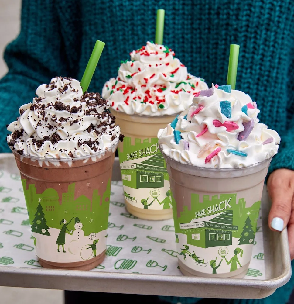 shake shack's trio of  holiday season shakes always feature chocolate, sprinkles and lots of whipped cream.