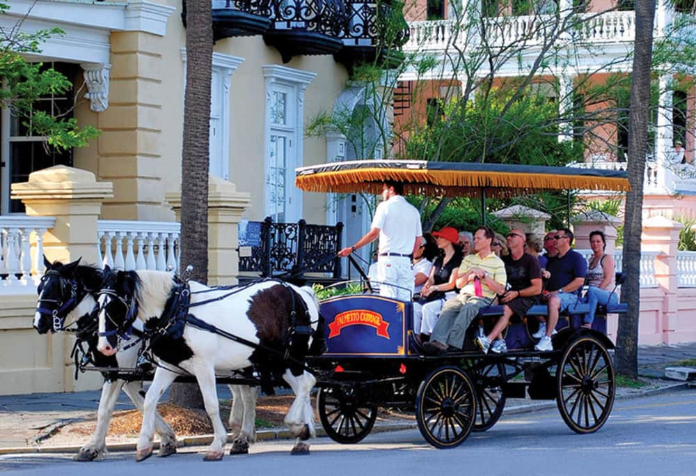 Horse-drawn carriages with fringe canopies are a fun and easy way to tour charleston in groups of no more than 12.