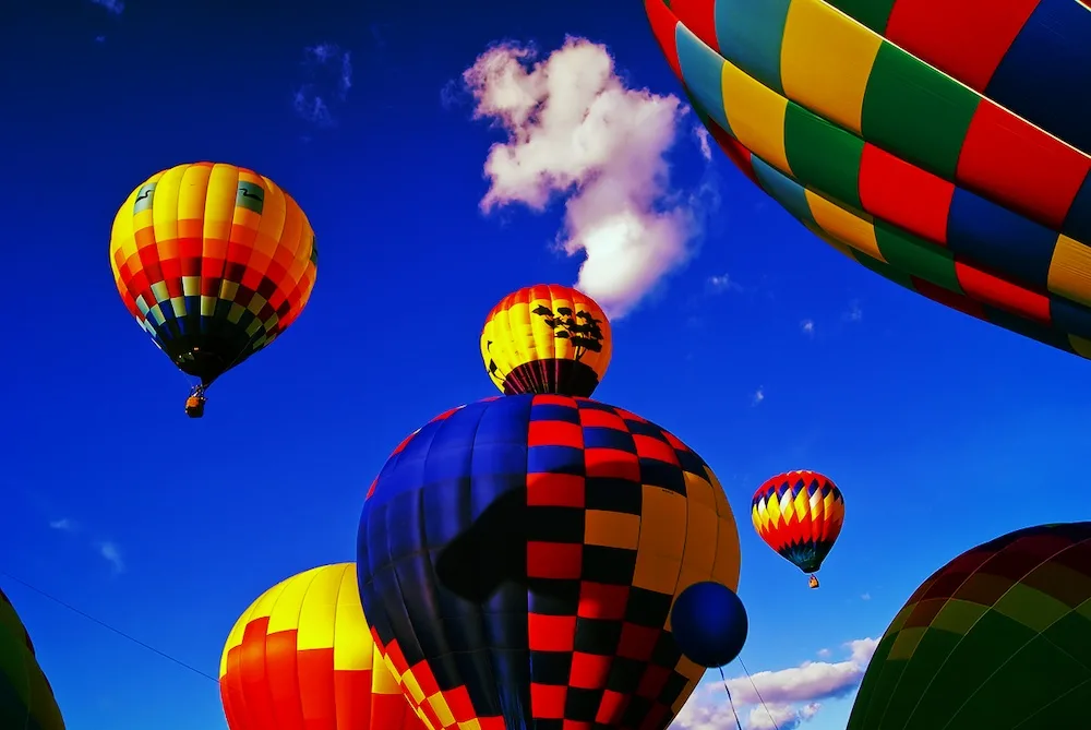 hot air balloons taking off in the berkshirs during the northeast hot air balloon festival.