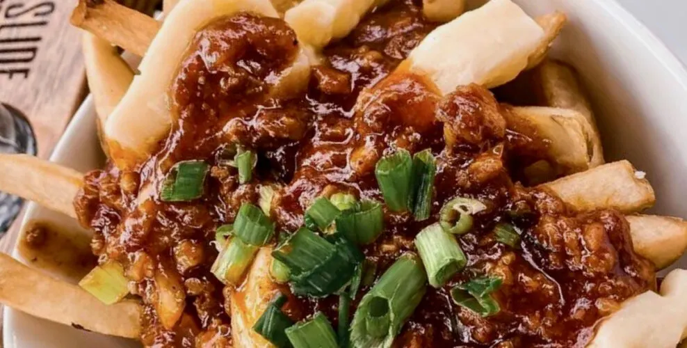 13 Restaurants We Never Miss When We Visit Lake Placid poutine from big slide brewery with peppercorn gravy and new york state cheese curds.