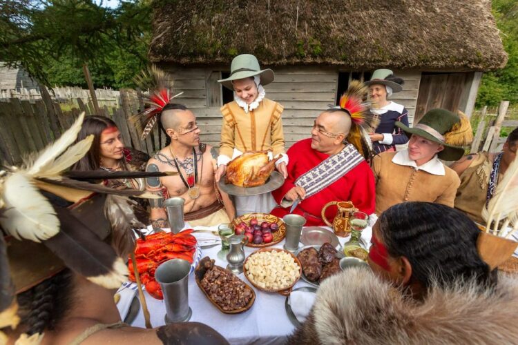 costumed interpreters celebrate thanksgiving at plimouth plantation.