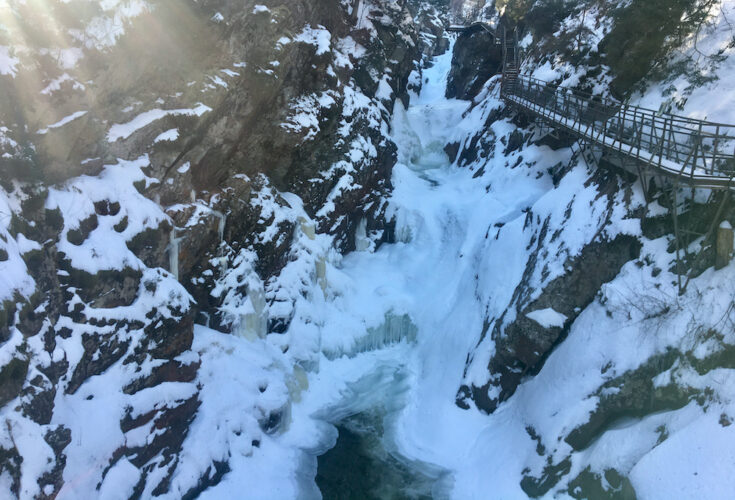 Frozen waterfalls cling to the rocks at high falls gorge near wilmington, ny