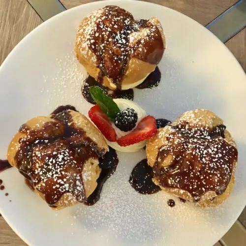 a trio of fudge-covered profiteroles from osteria brera in the grand canal shops