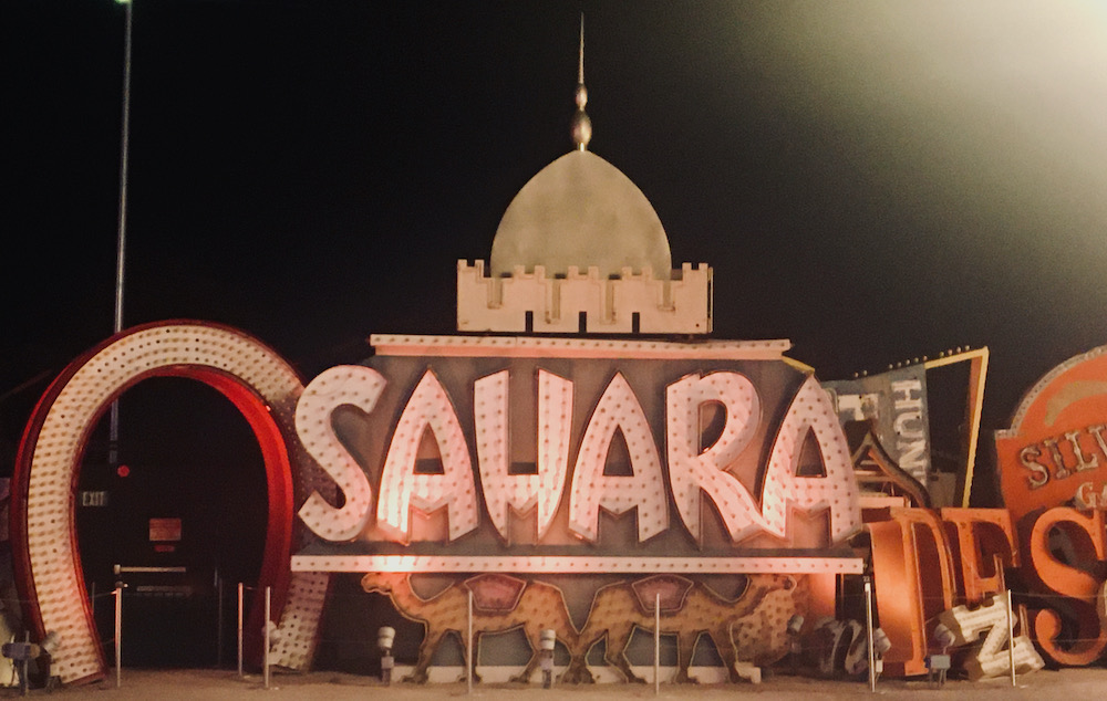 A partially restored sign for the sahara hotel at the neon museum's boneyard